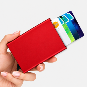 Crimson red minimal aluminum card holder with automatic lever trigger